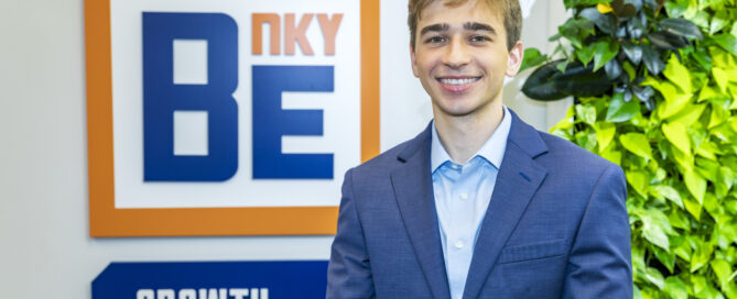 Robert McBride stands in front of BE NKY Growth Partnership sign
