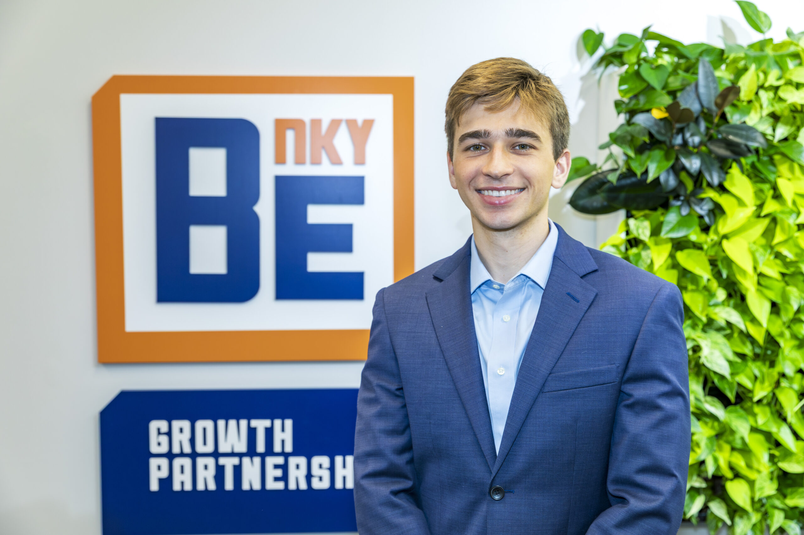 Robert McBride stands in front of BE NKY Growth Partnership sign