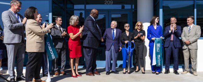 People cut ribbon in front of OneNKY Center main entrance